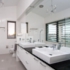Bathroom, tiled with glass features and large mirror