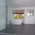 Tiled bathroom with two basins
